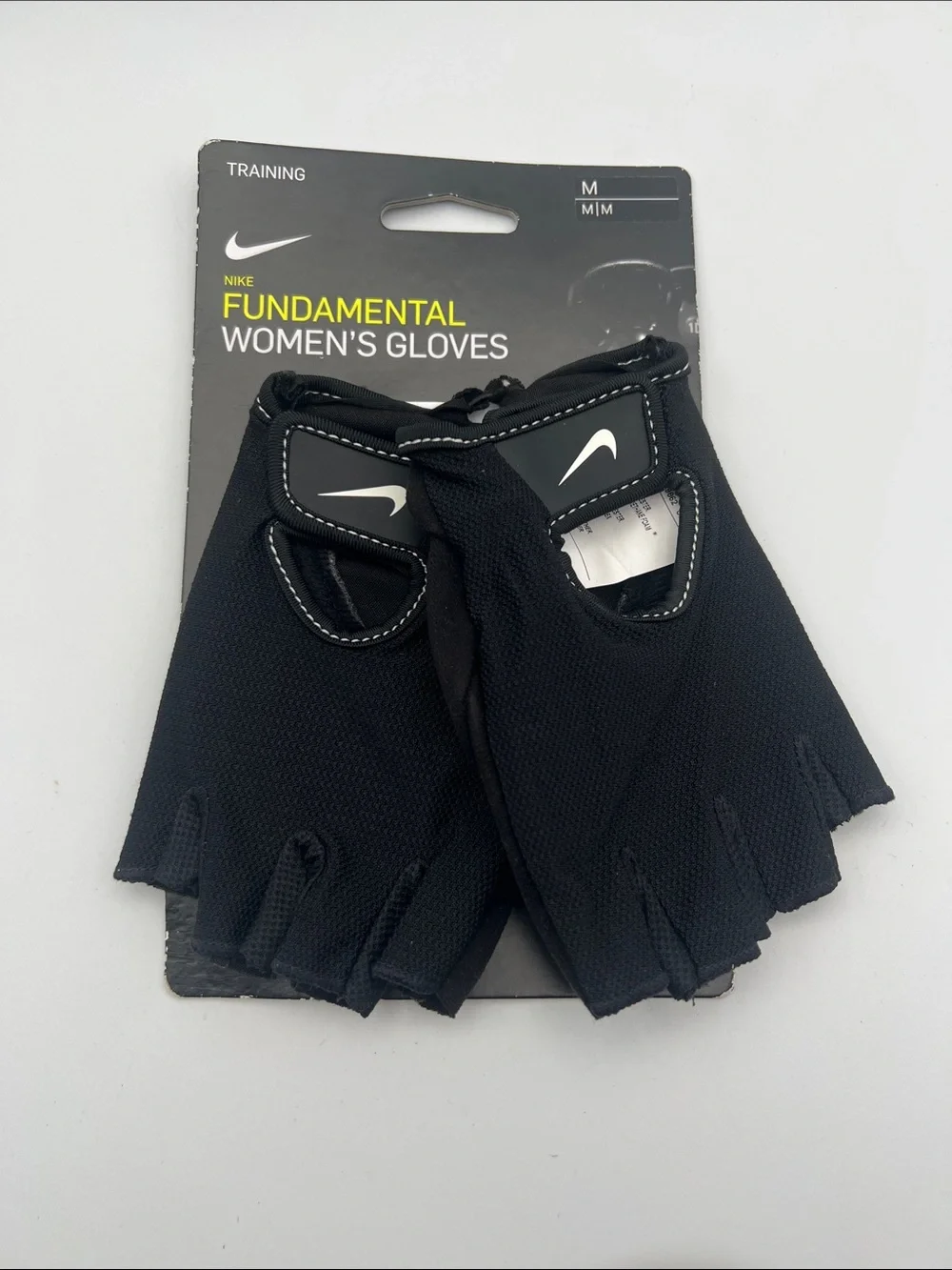 Nike Women's Black Fingerless Workout Gloves with White Swoosh